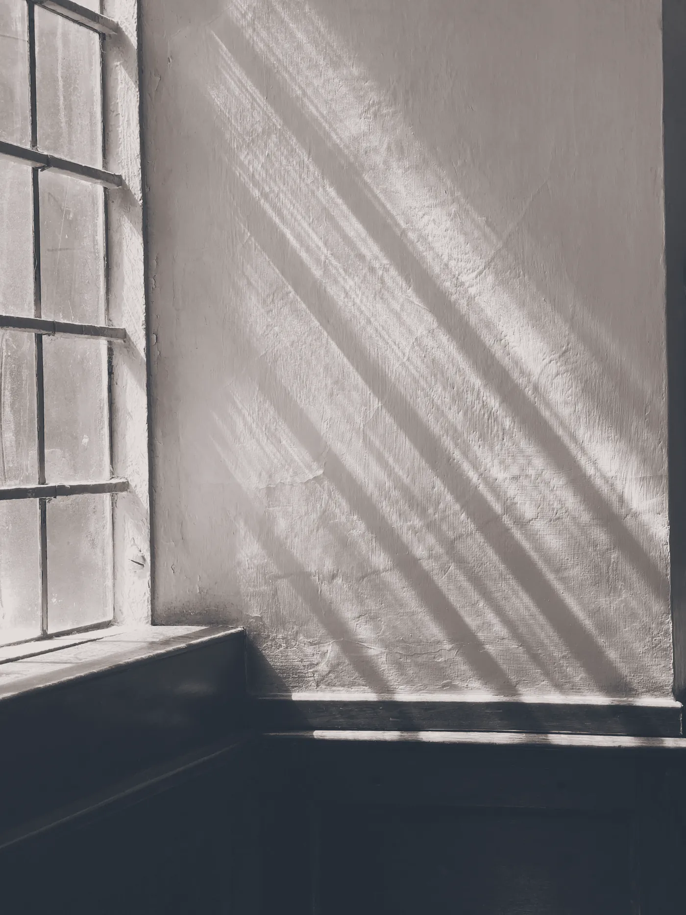 Sunlight falling through a tall window